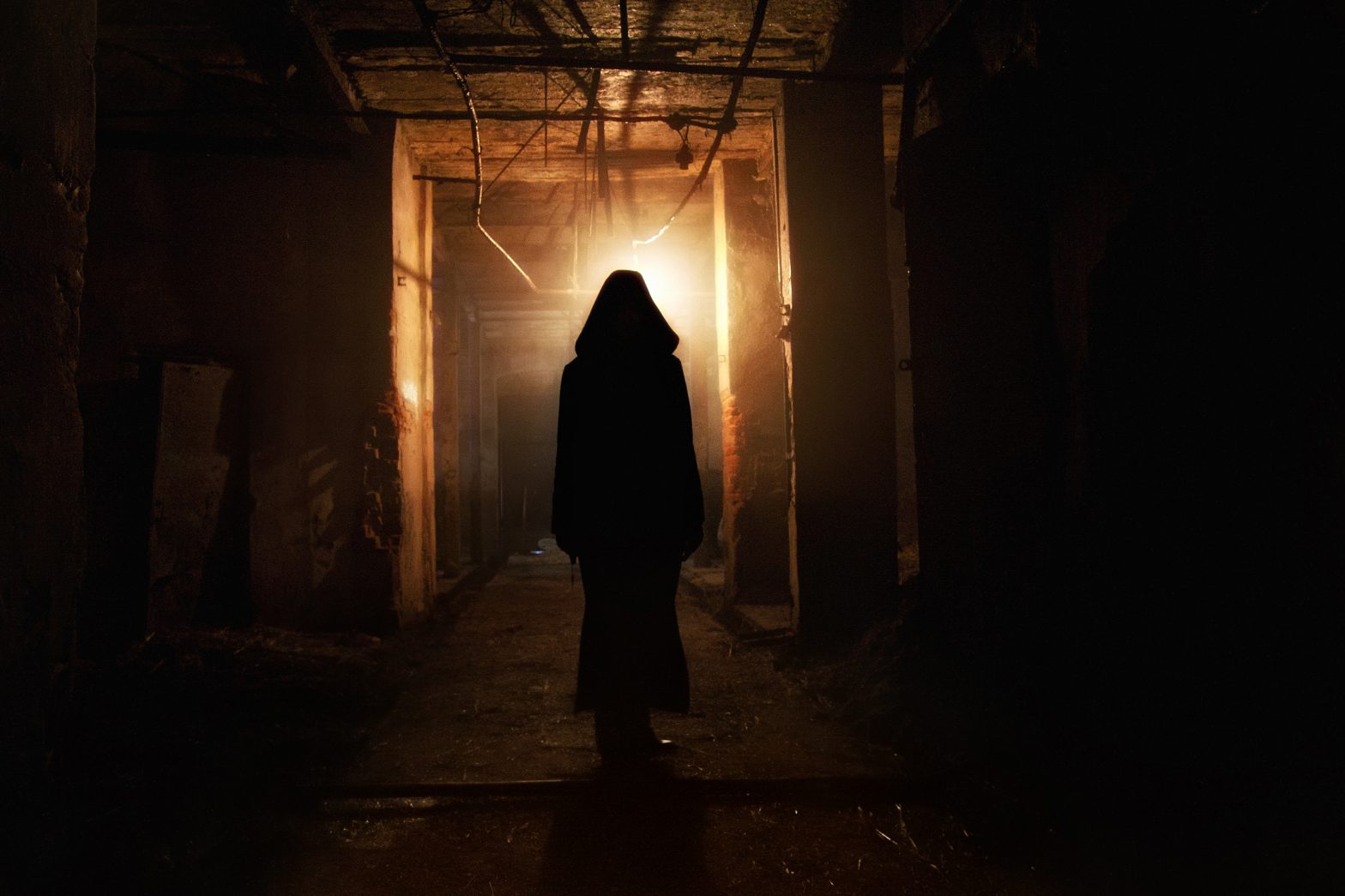 Creepy silhouette in a dark abandoned building