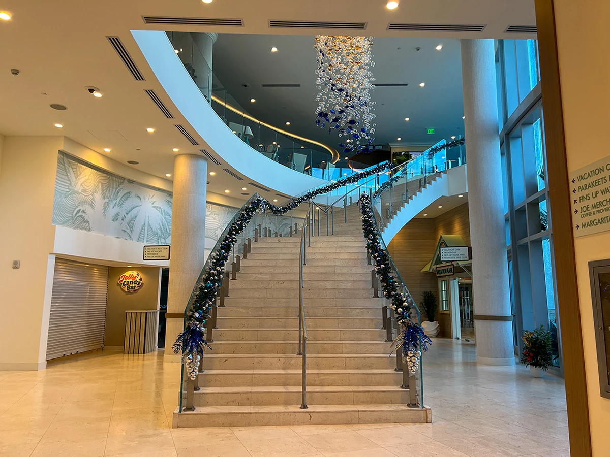 modern commercial building lobby with curved staircase